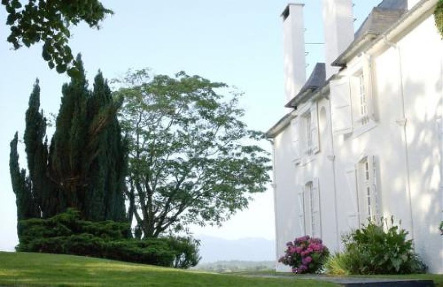 Clos mirabel exterior, manor house and gardens with view of the pyrenees.
