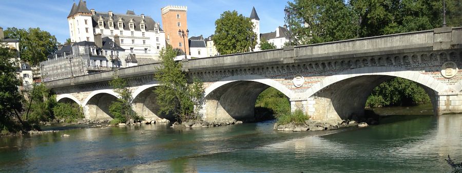 River with bridge and pau chateau in background.